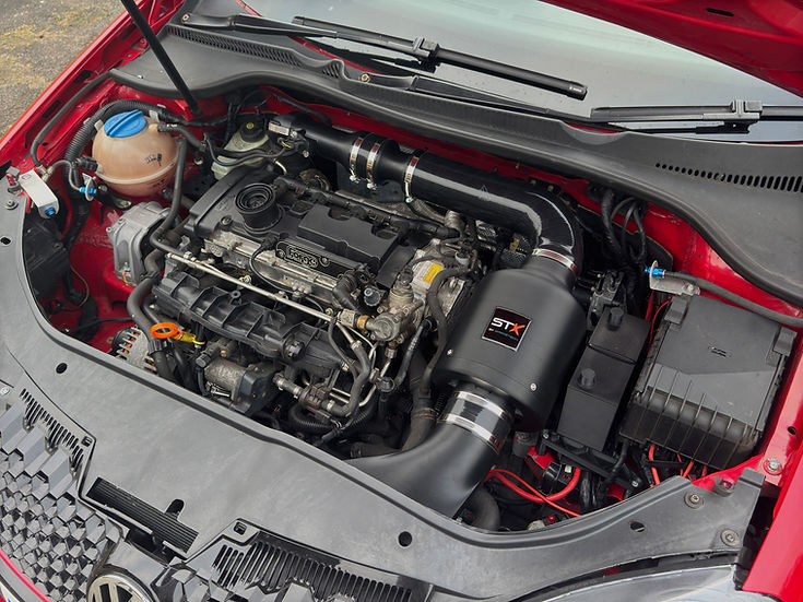 SprogTech STX EA3 enclosed intake kit for 2.0 TFSI engine, including air filter and intake tubing, by Sprogley Motorsport.